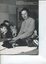 Dorothy Hamilton irons with four children around her