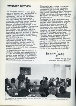 John Wilson speaks to  group of people at a meeting