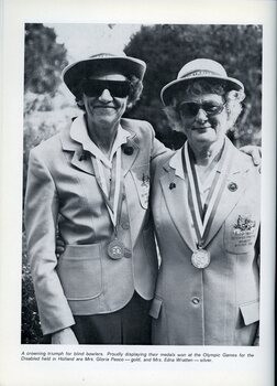 Gloria Pascoe and Edna Wratten with their Olympic medals dressed in team jackets and hats