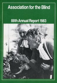 Two elderly woman, one holds a pot whilst another puts her hand under the leaves of a plant