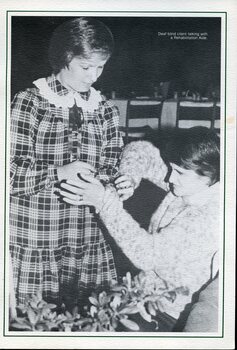 Deaf blind woman speaking with another woman