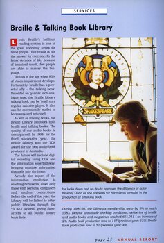 Beverley Dunn reads a book beneath the stained glass window of Shakespeare in the library.