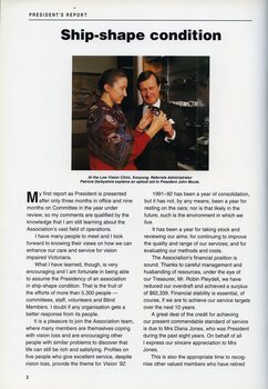 Patricia Darbyshire explains an optical aid to John Moule