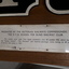 Cast iron train numbers mounted on wood with presentation plaque