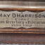 Nameplate for framed photograph of May Harrison