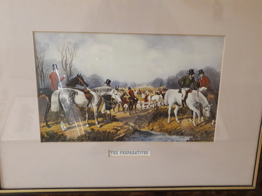 Men dressed in red coats, white shirts and jodhpurs with horses beside a stream