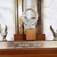 Wreath and two eagles that adorn the base of the trophy