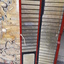 Fold out piece with metal labels brailled with names of countries