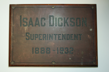 Bronze plaque with black writing