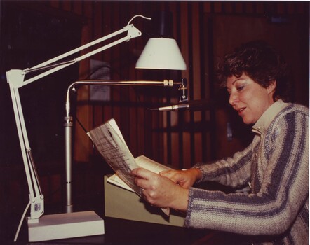 Narrator reading a book in the studios