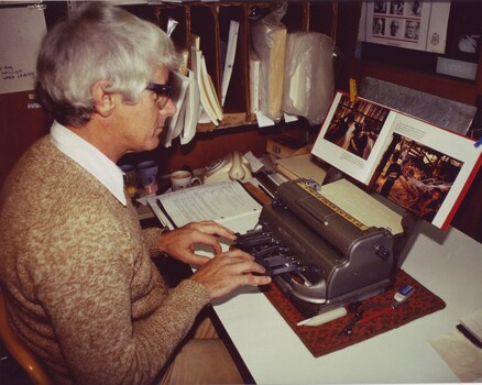 Volunteer transcriber using a Perkins as he transcribes a print book