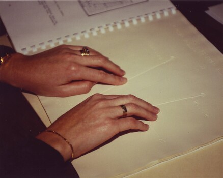 A woman's hands as she proofs a graph