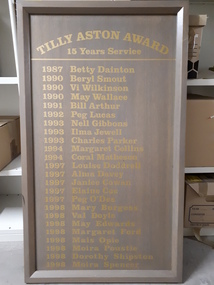 Grey wooden board with golden lettering