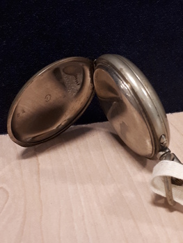 Silver watch with secondary case lid
