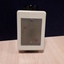 White rectangle with black dial on one side