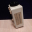 White rectangle with black dial on one side