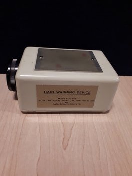 White rectangle with black dial on one side