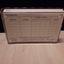 Rear of rectangular container showing paper label