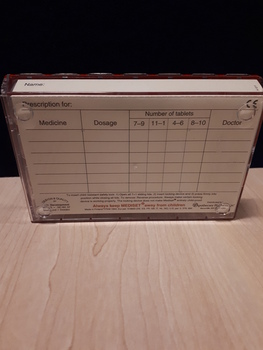 Rear of rectangular container showing paper label