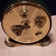 Rear of gold clock with winding mechanisms