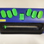 Blue rectangular device with bright green buttons
