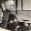 Male using a band saw in a workshop