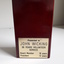 Rear of wooden maroon block with name plate on back