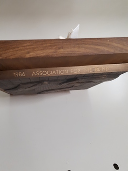 1986 Association for the Blind inscribed on top facing edge