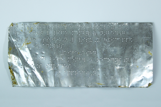 Metal sheet of Braille text to accompany plaque