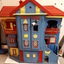 Wooden dolls house with doors.