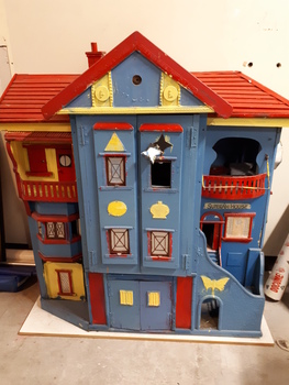 Wooden dolls house with doors.
