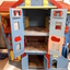 Wooden dolls house with doors.