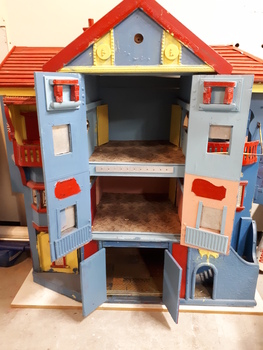 Wooden dolls house with doors.