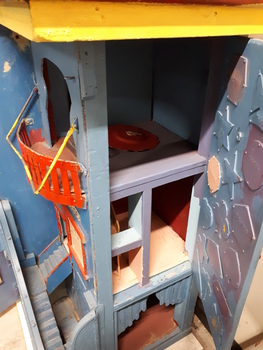Wooden dolls house with doors.