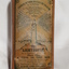 Metal rectangular box with images and writing printed on side