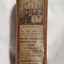 Metal rectangular box with images and writing printed on side