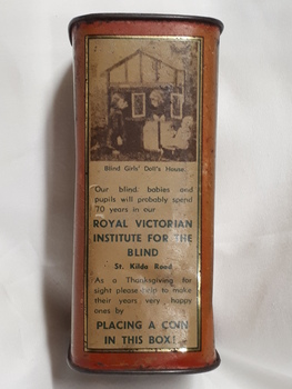 Metal rectangular box with images and writing printed on side