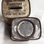 Metal rectangular box with images and writing printed on side
