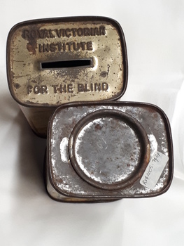 Metal rectangular box with images and writing printed on side