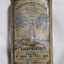Metal rectangular box with images and writing printed on side