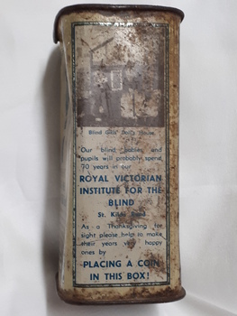 Metal rectangular box with images and writing printed on side
