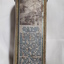Metal rectangular box with images and writing printed on side