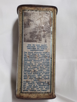 Metal rectangular box with images and writing printed on side