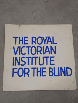 Blue writing on white cardboard
