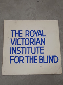 Blue writing on white cardboard