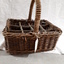 Cane basket with handle and dividers to carry milk bottles