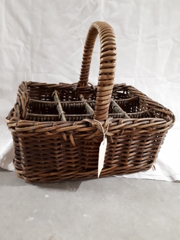Cane basket with handle and dividers to carry milk bottles