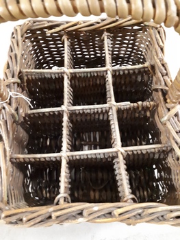 Cane basket with handle and dividers to carry milk bottles