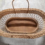 Rectangular basket with solid base, widening to top with handles each side