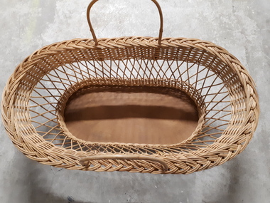 Rectangular basket with solid base, widening to top with handles each side
